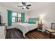 Comfortable bedroom with a queen-size bed and lake view at 13678 Yelma St, Venice, FL 34293