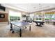 Bright game room with ping pong and pool tables at 13678 Yelma St, Venice, FL 34293