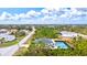 Aerial view of house and surrounding neighborhood at 14098 Baracoa Ln, Port Charlotte, FL 33981