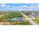 Aerial view showcasing home with private pickleball court at 14098 Baracoa Ln, Port Charlotte, FL 33981