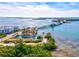 Aerial view showcasing waterfront property with boat slips and bridge access at 14098 Baracoa Ln, Port Charlotte, FL 33981