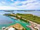 Aerial view of the waterfront with marina, bridge, and lush green islands on a clear day at 14098 Baracoa Ln, Port Charlotte, FL 33981