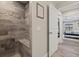 Modern bathroom with a walk-in shower and tiled walls at 14098 Baracoa Ln, Port Charlotte, FL 33981