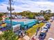 Aerial view of a vintage gallery building with an outdoor market, showcasing community and local art at 14098 Baracoa Ln, Port Charlotte, FL 33981