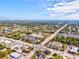 Aerial shot of a community with lush greenery and a mix of commercial and residential properties at 14098 Baracoa Ln, Port Charlotte, FL 33981
