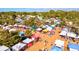 Lively aerial view of an outdoor market with colorful tents and numerous shoppers at 14098 Baracoa Ln, Port Charlotte, FL 33981