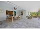 Covered patio with dining area and access to the house at 14098 Baracoa Ln, Port Charlotte, FL 33981