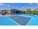 Outdoor pickleball court; home visible in background at 14098 Baracoa Ln, Port Charlotte, FL 33981