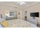 Main bedroom with king bed and mirrored closet doors at 157 Tampa E Ave # 208, Venice, FL 34285