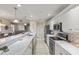 Modern kitchen with stainless steel appliances and white cabinetry at 157 Tampa E Ave # 208, Venice, FL 34285