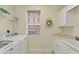 Laundry room with washer, dryer, and cabinets at 157 Tampa E Ave # 208, Venice, FL 34285