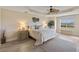 Relaxing main bedroom with large windows and ceiling fan at 157 Tampa E Ave # 208, Venice, FL 34285