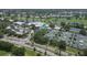 Aerial view of community with clubhouse, pool, and tennis courts at 1584 Monarch Dr, Venice, FL 34293