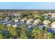 Aerial view of houses near a lake at 1584 Monarch Dr, Venice, FL 34293