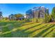 Backyard view of multiple homes with screened patios at 1584 Monarch Dr, Venice, FL 34293