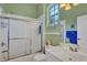 Small bathroom with tub and shower at 1584 Monarch Dr, Venice, FL 34293