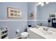 Clean bathroom with white vanity and decorative accents at 1584 Monarch Dr, Venice, FL 34293