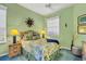 Bedroom with wood furniture and green walls at 1584 Monarch Dr, Venice, FL 34293