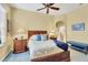 Bedroom with wood bed frame and blue blanket at 1584 Monarch Dr, Venice, FL 34293