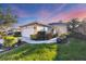 Well-maintained house with a landscaped lawn and a two-car garage at 1584 Monarch Dr, Venice, FL 34293