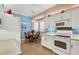 Kitchen nook with table and chairs, adjacent to kitchen at 1584 Monarch Dr, Venice, FL 34293