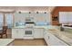 Modern kitchen with white cabinets and granite countertops at 1584 Monarch Dr, Venice, FL 34293