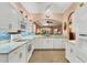 Modern kitchen with white cabinets and granite countertops at 1584 Monarch Dr, Venice, FL 34293