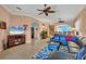 Open living area with comfortable seating and tile floors at 1584 Monarch Dr, Venice, FL 34293
