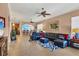 Spacious living room featuring a sectional sofa and large TV at 1584 Monarch Dr, Venice, FL 34293