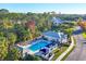 Community pool with clubhouse and lounge chairs at 1584 Monarch Dr, Venice, FL 34293