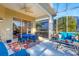 Spacious covered patio with seating and access to interior at 1584 Monarch Dr, Venice, FL 34293