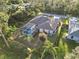 Single-story house with a fenced-in pool and tropical landscaping at 1684 Ruiz St, North Port, FL 34286