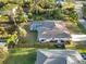 Aerial view showing home, pool, and fenced yard at 1684 Ruiz St, North Port, FL 34286