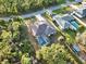 Single-story house with pool and backyard, surrounded by trees at 1684 Ruiz St, North Port, FL 34286