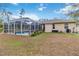 Backyard with screened pool and patio area at 1684 Ruiz St, North Port, FL 34286