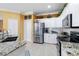 Modern kitchen with stainless steel appliances and granite countertops at 1684 Ruiz St, North Port, FL 34286