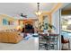 Tan leather sectional sofa, large TV, and view of the pool at 1684 Ruiz St, North Port, FL 34286
