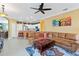 Spacious living room with a large sectional sofa and coffee table at 1684 Ruiz St, North Port, FL 34286