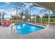 Inviting screened pool area with lounge chairs and a clear view at 1684 Ruiz St, North Port, FL 34286