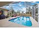 Inviting screened pool area with lounge chairs and a clear view at 1684 Ruiz St, North Port, FL 34286