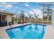 Refreshing screened pool with plenty of space for lounging at 1684 Ruiz St, North Port, FL 34286