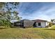 Spacious backyard with screened pool and tranquil lake view at 1723 N Gondola Ct, Venice, FL 34293