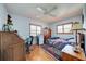 Cozy bedroom with a charming patchwork quilt and built-in desk at 1723 N Gondola Ct, Venice, FL 34293