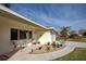 Relaxing front porch with seating and nicely landscaped area at 1723 N Gondola Ct, Venice, FL 34293