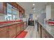 Kitchen boasts granite counters, stainless steel appliances, and ample cabinetry at 1723 N Gondola Ct, Venice, FL 34293