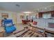 Open living space with white couch, wood coffee table, and view into dining area at 1723 N Gondola Ct, Venice, FL 34293