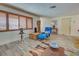 Bright living room featuring hardwood floors and a blue recliner at 1723 N Gondola Ct, Venice, FL 34293