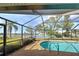Refreshing pool with screened enclosure overlooking lake at 1723 N Gondola Ct, Venice, FL 34293