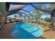 Relaxing kidney shaped pool with screened enclosure at 1723 N Gondola Ct, Venice, FL 34293