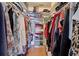 Large walk-in closet with ample hanging space and shelving at 1723 N Gondola Ct, Venice, FL 34293